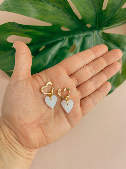 White Heart Earrings in a pearlescent sparkly colour on 18k gold plated clasp hoops. Heart shaped hoops // LOLA